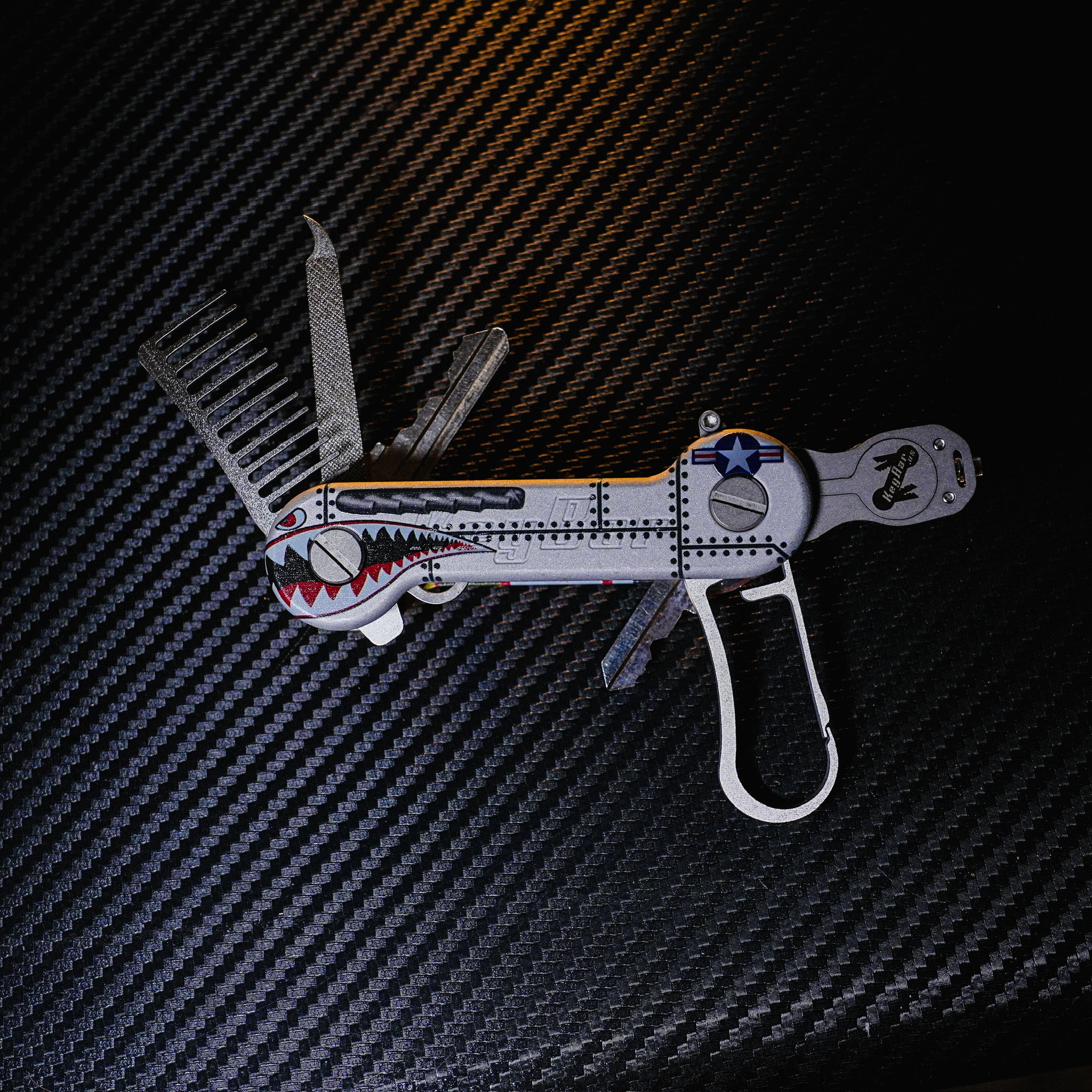 Bomber Aluminum UV Printed KeyBar Key and Tool Holder open front with titanium, Keyrabiner 5.0, beard comb, and nail file, and flashlight.