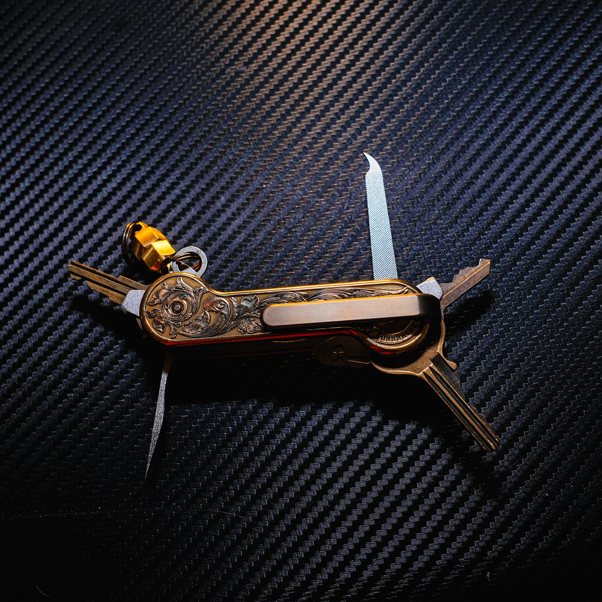 Brass Engraverhand KeyBar Key and Tool Holder open back with titanium deep carry pocket clip, pick, and nail file, brass MagNuts, and aluminum Quick Key Tabs.