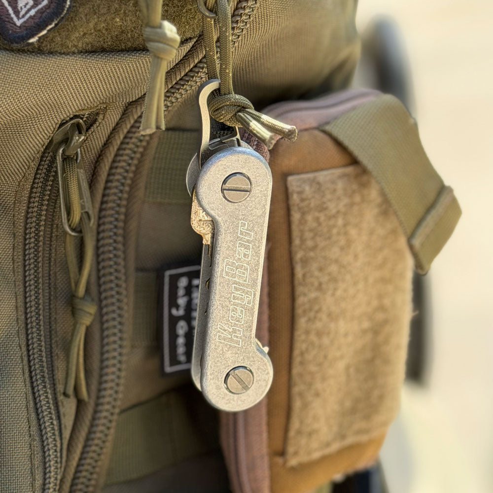 Titanium-Keyrabiner-4.0-on-KeyBar-Key-and-Tool-Holder-hanging-on-backpack