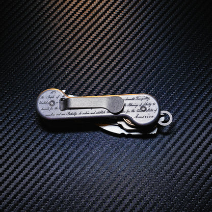 Aluminum Freedom KeyBar Key and Tool Holder closed back with standard titanium pocket clip, key fob and bottle opener.