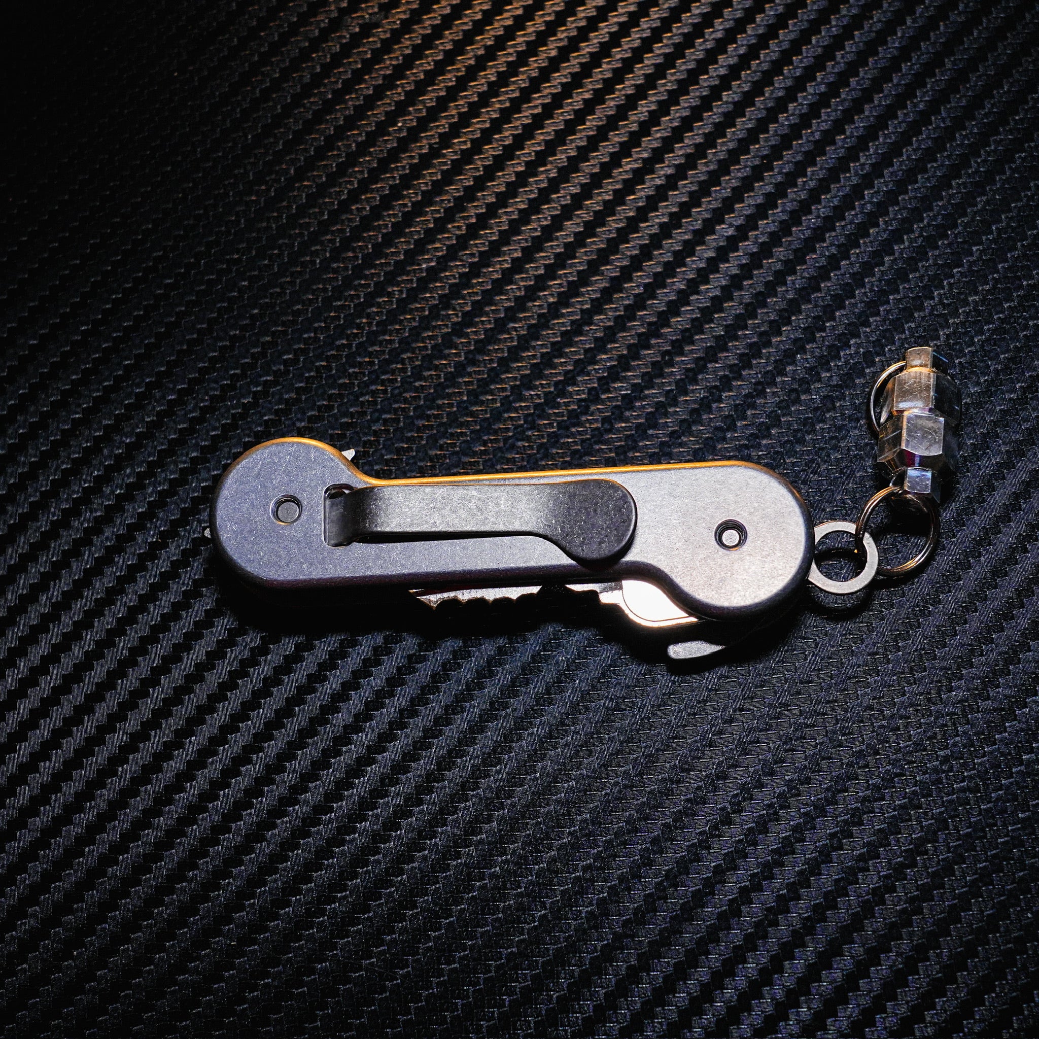 Aluminum KeyBar Key and Tool Holder closed back with standard titanium pocket clip and aluminum MagNuts.