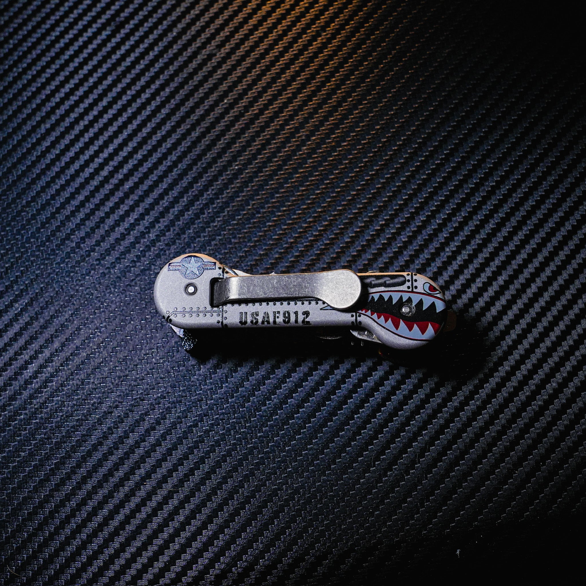 Aluminum UV Bomber KeyBar Key and Tool Holder closed back with standard titanium pocket clip.