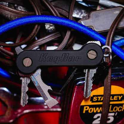 Black-G10-KeyBar-Key-and-Tool-Organizer-open-front-with-Multi-Tool-and-Black-Anodized-Aluminum-MagNuts