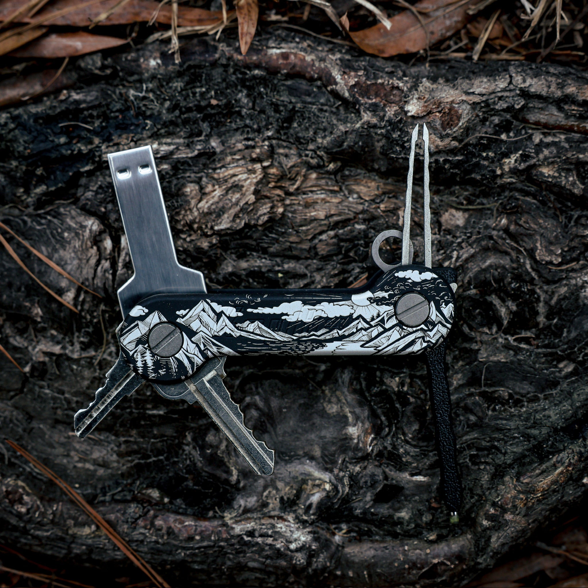 Black_Anodized_Aluminum_Sierra_Aluminum_KeyBar_Key_and_Tool_Organizer_open_front_with_flash_drive_titanium_tweezers_and_pen_insert