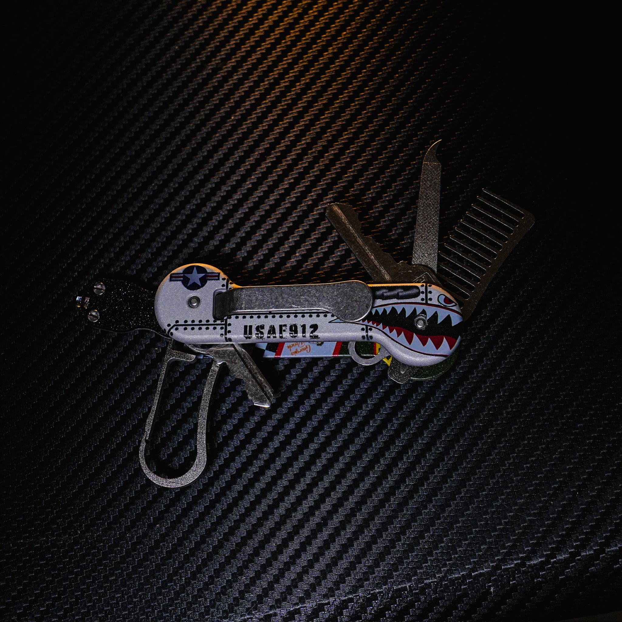 Bomber UV Printed Aluminum KeyBar Key and Tool Organizer open back with titanium keyrabiner 5.0, nail file, and beard comb, and flashlight.