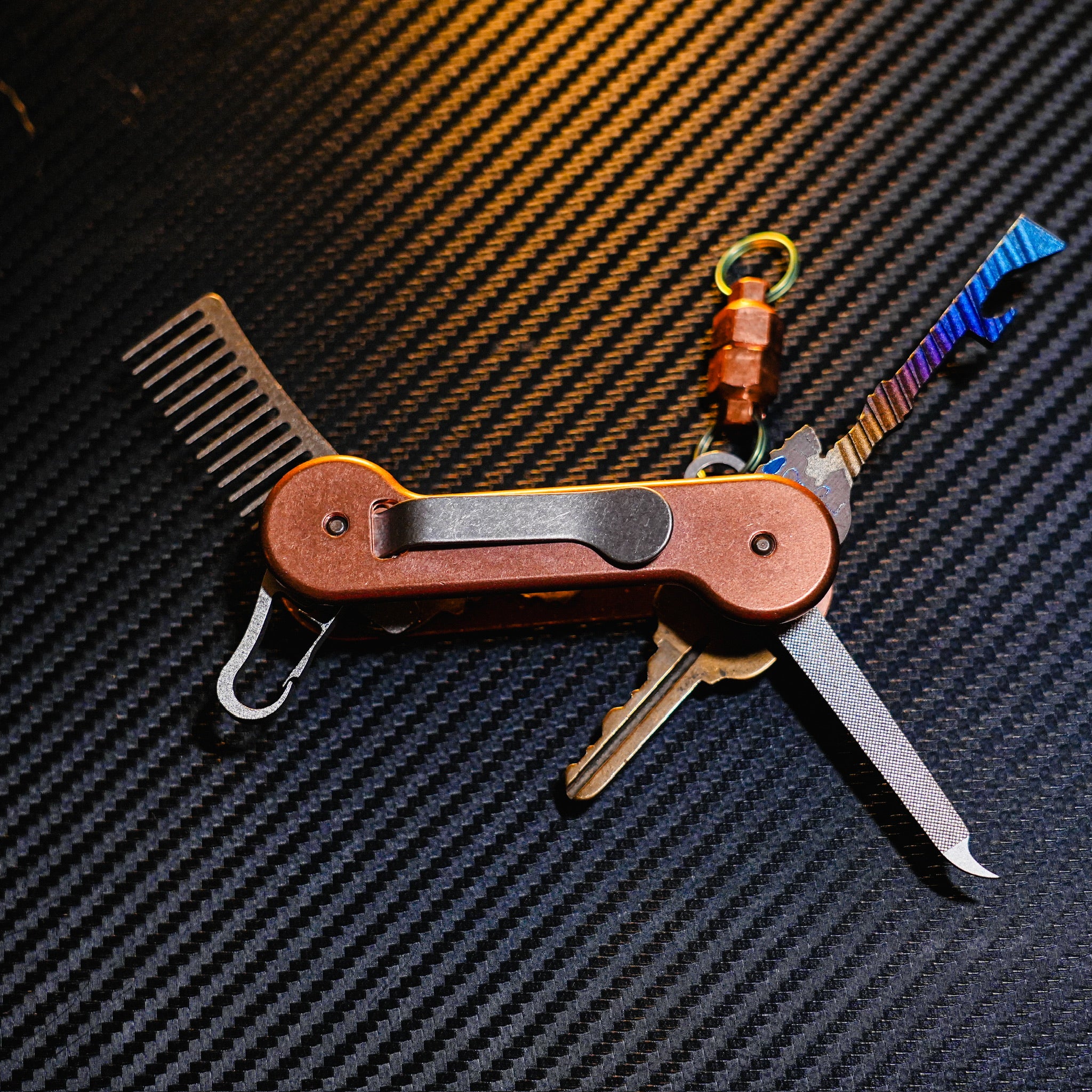 Copper KeyBar Key and Tool Holder open back with Skeleton key, copper MagNuts, titanium beard comb, keyrabiner 4.0 and nail file.