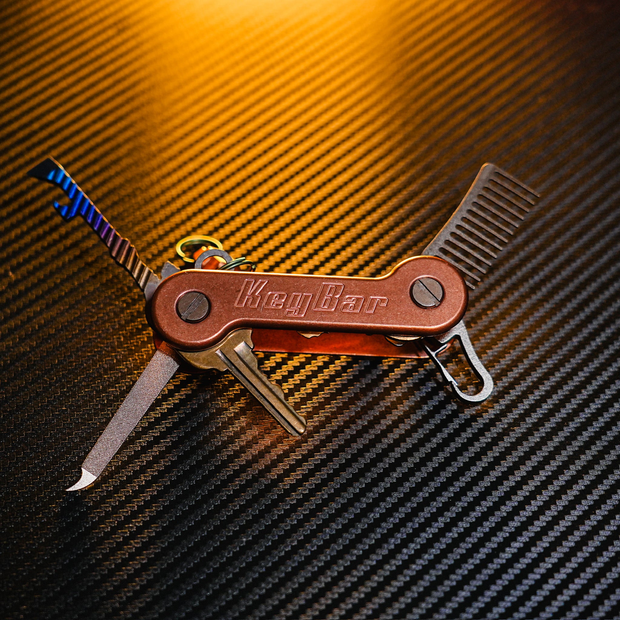 Copper KeyBar open front with titanium skeleton key, nail file, keyrabiner 4.0, and beard comb.