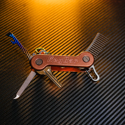Copper KeyBar open front with titanium skeleton key, nail file, keyrabiner 4.0, and beard comb.