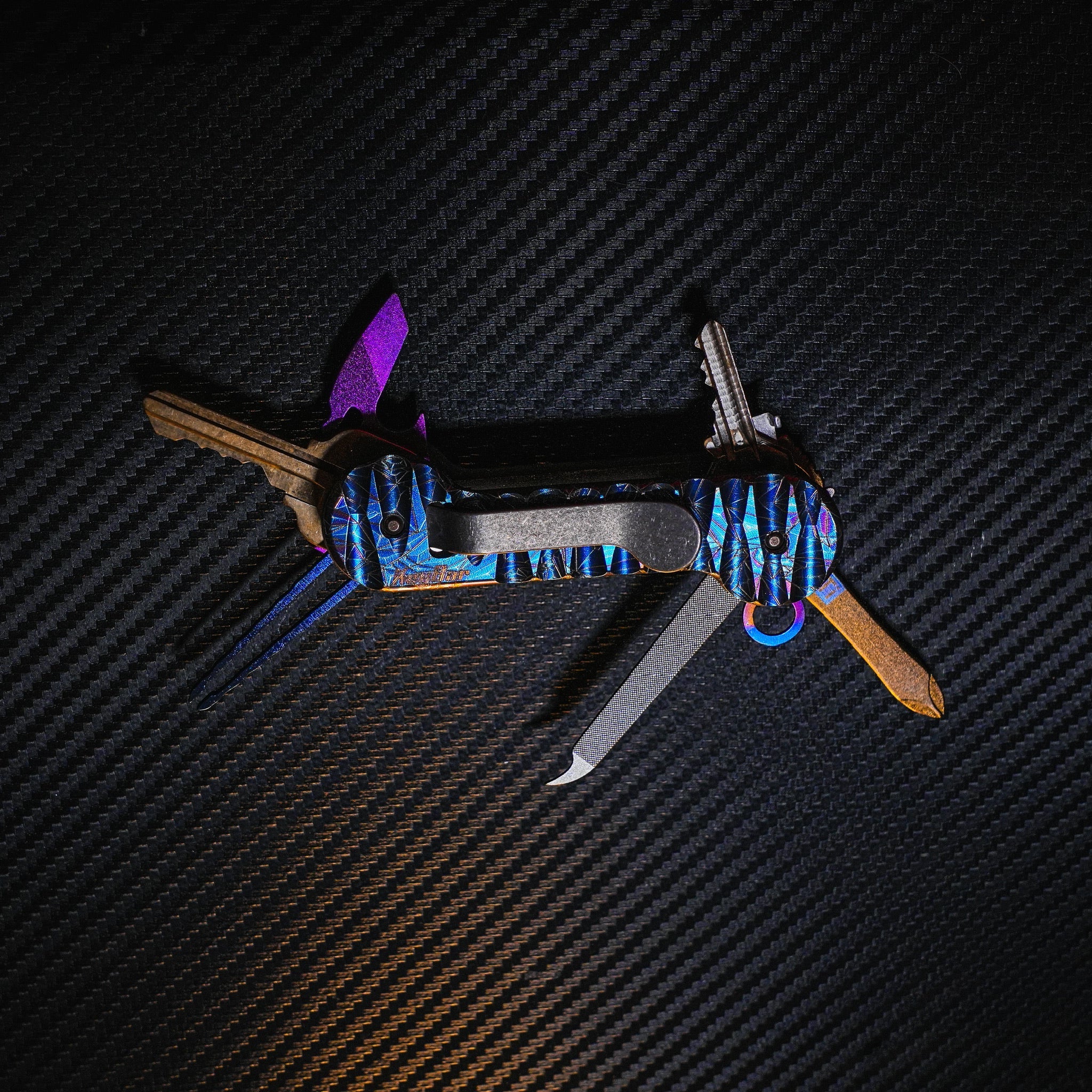 Crystallized Slayer Titanium KeyBar Key and Tool Holder with titanium bottle opener, nail file and tweezers.