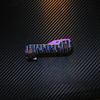 Crystallized Slayer Titanium KeyBar Key and Tool Organizer with titanium nail file, titanium phillips head screwdriver, titanium bottle opener, titanium tweezers and aluminum quick key tab - closed.