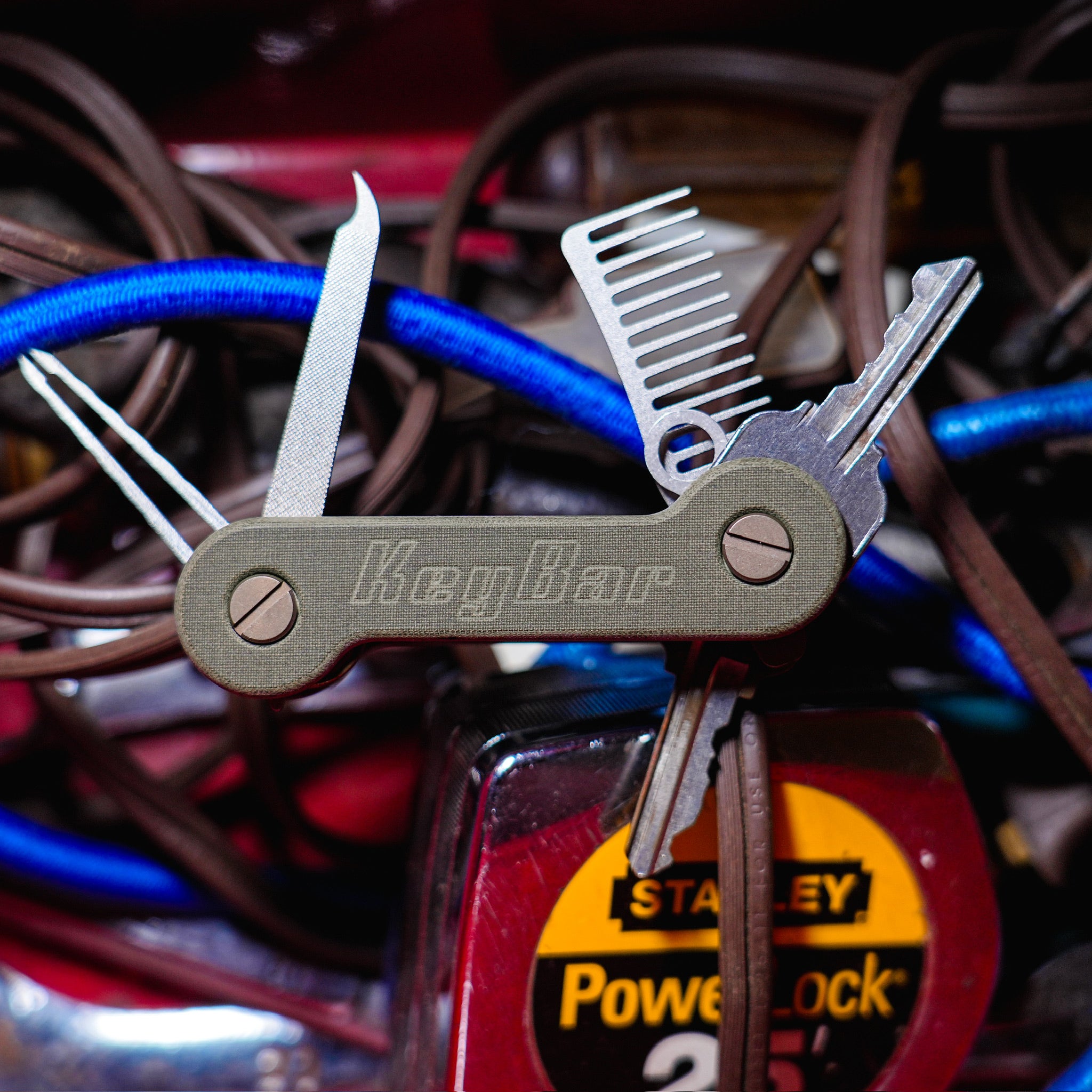 Green Micarta KeyBar Key and Tool Holder with tiitanium pick, nail file, and comb front