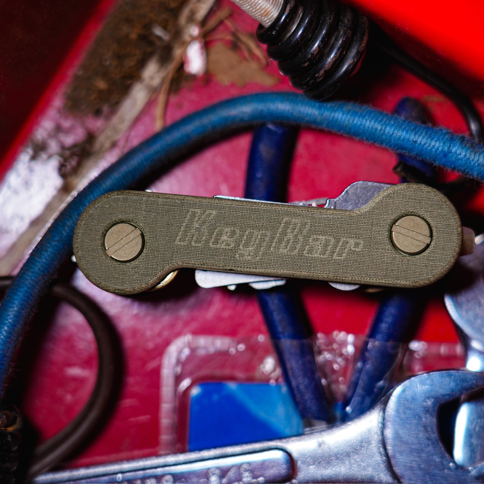 Green Micarta KeyBar Key and Tool Holder with tiitanium pick, nail file, and comb front closed