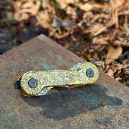 Honeycomb-Brass-KeyBar-Key-and-Tool-Organizer-lifestyle-image-on-boat-metal