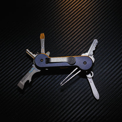 Midnight Titanium KeyBar Key and Tool Holder open back with standard titanium pocket clip, phillips head screwdriver, flathead screwdriver, tweezers, key fob link, and multi-tool.