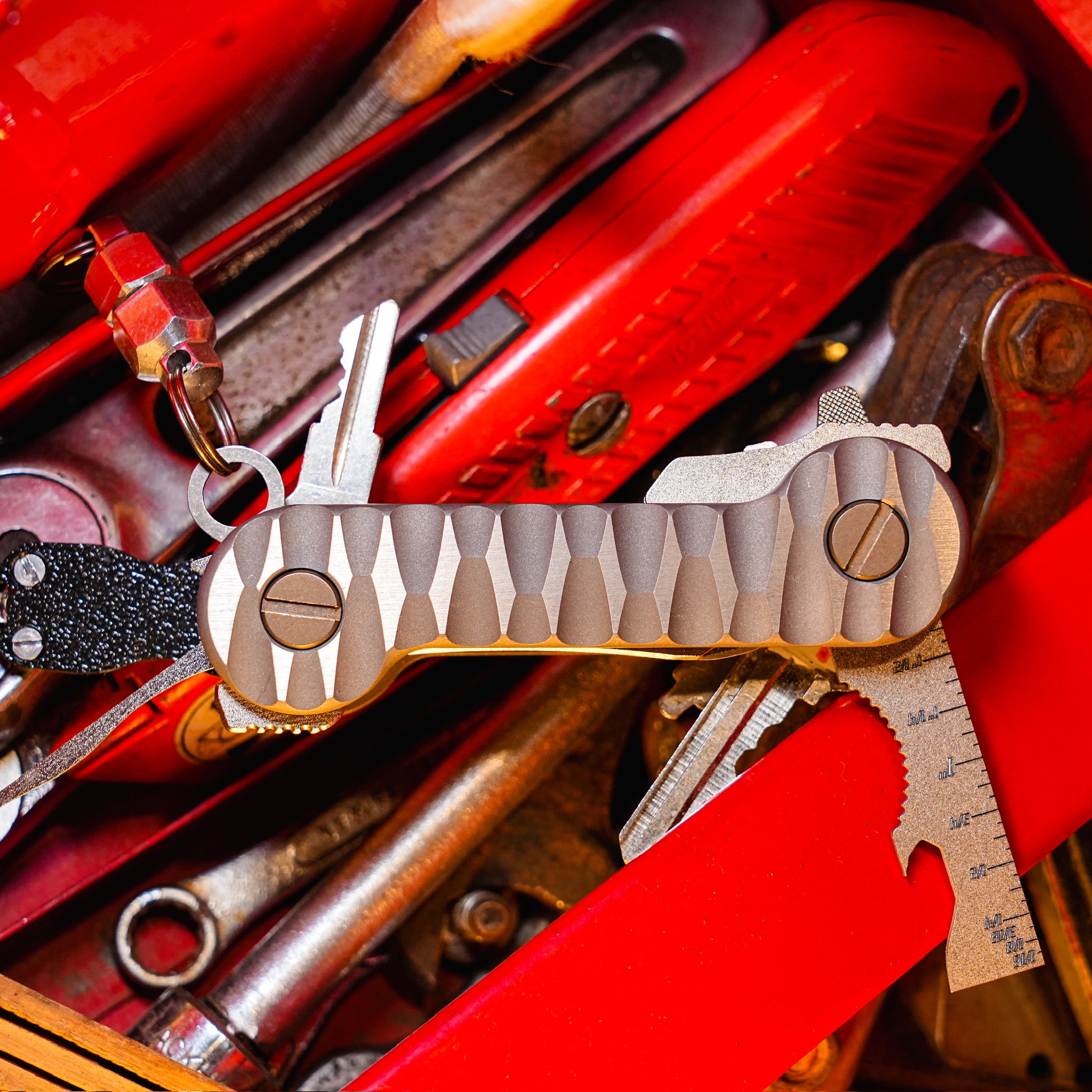 Slayer_Titanium_KeyBar_Key_and_Tool_Organizer_with_standard_titanium_pocket_clip_and_multi_tool_and_flashlight_front