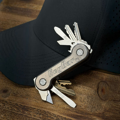 Titanium-KeyBar-Key-Organizer-with-keys_-bottle-bomber_-phillips-screwdriver_-flathead-screwdriver_-mini-utility-tool-razor-blade-on-hat