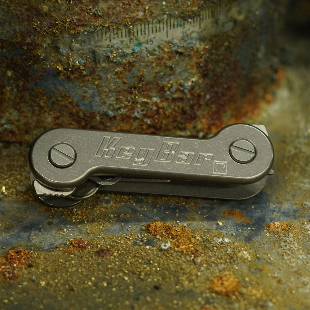 Titanium-KeyBar-Key-and-Tool-Organizer-Front-Closed-with-Titanium-File_-Flathead-Screwdriver-and-Phillips-Screwdriver-On-Chips
