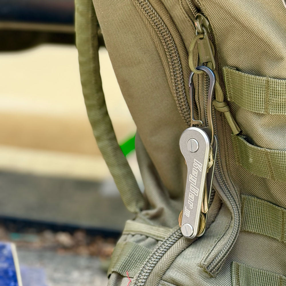 Titanium-Keyrabiner-5.0-on-KeyBar-Key-and-Tool-Holder-hanging-off-backpack