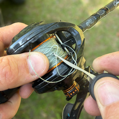 Titanium-Pick-in-KeyBar-Key-and-Tool-Holdler-Untangling-Fishing-Line-From-Reel